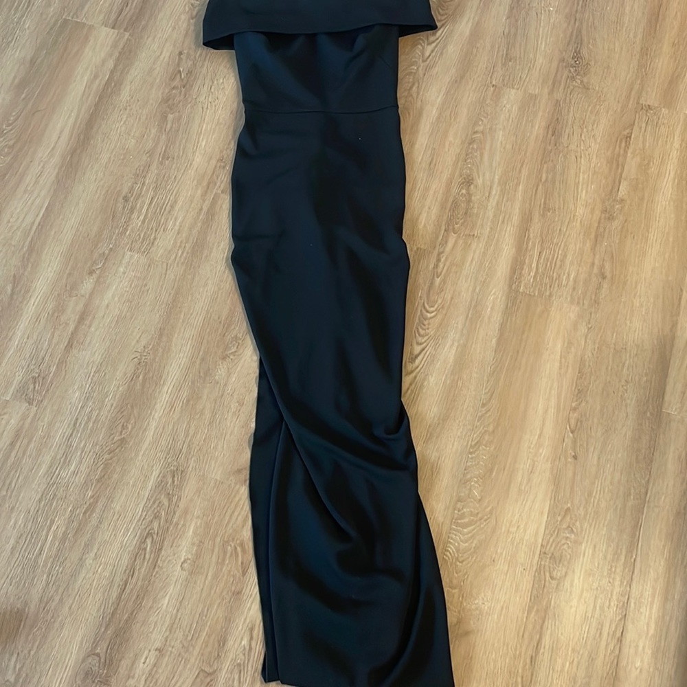 Evening gown off shoulder with ruffle back. Long fitted